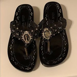 Louis Vuitton black tigers eye sandals.